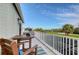 Private balcony overlooking the golf course and water at 3408 Fair Oaks Ln, Longboat Key, FL 34228