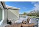 Outdoor patio furniture on a balcony overlooking the golf course at 3408 Fair Oaks Ln, Longboat Key, FL 34228