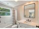 Clean and bright bathroom with a bathtub and shower at 3408 Fair Oaks Ln, Longboat Key, FL 34228