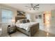 Main bedroom with king-size bed, ensuite bathroom access, and a ceiling fan at 3408 Fair Oaks Ln, Longboat Key, FL 34228
