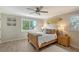 Cozy bedroom with wood flooring and plenty of natural light at 3408 Fair Oaks Ln, Longboat Key, FL 34228