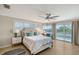 Bright bedroom with water views and built-in workspace at 3408 Fair Oaks Ln, Longboat Key, FL 34228