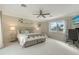 Comfortable bedroom with water views and built-in workspace at 3408 Fair Oaks Ln, Longboat Key, FL 34228