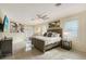 Spacious bedroom with a large bed, ceiling fan, and plenty of natural light at 3408 Fair Oaks Ln, Longboat Key, FL 34228