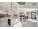 Modern kitchen with white cabinets, large island, and breakfast bar at 3408 Fair Oaks Ln, Longboat Key, FL 34228