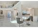 Open concept kitchen with breakfast bar and view into living area at 3408 Fair Oaks Ln, Longboat Key, FL 34228