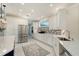Modern kitchen with stainless steel appliances and white cabinetry at 3408 Fair Oaks Ln, Longboat Key, FL 34228