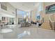 Bright and spacious living area with high ceilings, fireplace and staircase at 3408 Fair Oaks Ln, Longboat Key, FL 34228