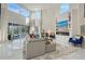 Living room with high ceilings and large windows offering natural light at 3408 Fair Oaks Ln, Longboat Key, FL 34228