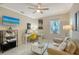Home office features a desk, seating area, and large window at 3408 Fair Oaks Ln, Longboat Key, FL 34228
