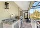 Outdoor kitchen with granite countertop and stainless steel appliances at 3408 Fair Oaks Ln, Longboat Key, FL 34228