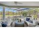 Spacious screened-in patio with comfy seating at 3408 Fair Oaks Ln, Longboat Key, FL 34228