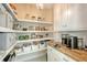 Well-organized pantry with ample shelving and storage at 3408 Fair Oaks Ln, Longboat Key, FL 34228