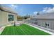 Private rooftop patio with artificial turf and city views at 3408 Fair Oaks Ln, Longboat Key, FL 34228