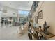 Elegant staircase with wrought-iron railings and a console table at 3408 Fair Oaks Ln, Longboat Key, FL 34228