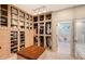 Large walk-in closet with ample shelving and drawers at 3408 Fair Oaks Ln, Longboat Key, FL 34228