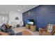 Living room featuring a blue shiplap wall and cozy armchairs at 3668 Turning Tides Ter, Bradenton, FL 34208