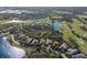Panoramic aerial view of a residential community with a golf course, lakes, and lush green landscaping at 3769 Caledonia Ln, Sarasota, FL 34240