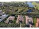 Aerial view of upscale homes, golf course, and lake at 3769 Caledonia Ln, Sarasota, FL 34240