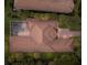 Aerial view of the home showing the backyard pool, tile roof, driveway, and mature trees at 3769 Caledonia Ln, Sarasota, FL 34240