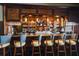 Well-equipped bar with ample seating and a variety of liquors at 3769 Caledonia Ln, Sarasota, FL 34240