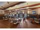 Community clubhouse bar area with seating and a fireplace at 3769 Caledonia Ln, Sarasota, FL 34240