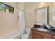Bright bathroom featuring a shower-tub combination and granite topped vanity at 3769 Caledonia Ln, Sarasota, FL 34240