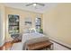 Bedroom featuring stylish chandelier and large windows at 3769 Caledonia Ln, Sarasota, FL 34240