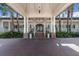 Elegant community clubhouse entrance with brick pavers and covered walkway at 3769 Caledonia Ln, Sarasota, FL 34240