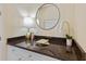 Bathroom countertop featuring cabinets, granite countertop, and decor at 3769 Caledonia Ln, Sarasota, FL 34240