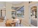 A bright dining area features a breakfast nook with views of the pool and access to the screened lanai at 3769 Caledonia Ln, Sarasota, FL 34240