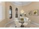 Bright dining room with a glass table and four chairs at 3769 Caledonia Ln, Sarasota, FL 34240