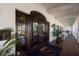 Elegant clubhouse entrance with dark wood doors and a logo at 3769 Caledonia Ln, Sarasota, FL 34240