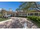 Community clubhouse with covered porch and brick pavers at 3769 Caledonia Ln, Sarasota, FL 34240