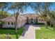 Exterior elevation of a single-Gathering home with a tile roof, a brick driveway, and a three-car garage at 3769 Caledonia Ln, Sarasota, FL 34240