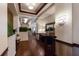 Bright and spacious hallway with hardwood floors and art at 3769 Caledonia Ln, Sarasota, FL 34240