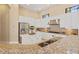Gourmet kitchen featuring stainless steel appliances, granite countertops, and custom cabinetry at 3769 Caledonia Ln, Sarasota, FL 34240