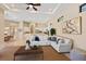 Open concept living room with kitchen in the background at 3769 Caledonia Ln, Sarasota, FL 34240