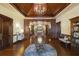 Lobby with a large wooden table and comfortable seating at 3769 Caledonia Ln, Sarasota, FL 34240