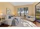Bright main bedroom with a sitting area by the window, creating a relaxing and inviting space at 3769 Caledonia Ln, Sarasota, FL 34240