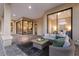 Outdoor living space featuring wicker furniture, stone pavers, and multiple access points at 3769 Caledonia Ln, Sarasota, FL 34240