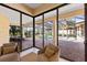 View from sunroom showcasing outdoor patio and screened-in pool area at 3769 Caledonia Ln, Sarasota, FL 34240