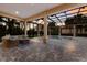 Screened-in pool area with an outdoor living space and beautiful sunset views at 3769 Caledonia Ln, Sarasota, FL 34240