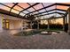 Screened-in pool area with integrated spa, patio and view to home at 3769 Caledonia Ln, Sarasota, FL 34240