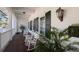 Relaxing clubhouse porch with rocking chairs and lush plants at 3769 Caledonia Ln, Sarasota, FL 34240