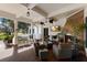 Covered porch with wicker furniture and a fireplace at 3769 Caledonia Ln, Sarasota, FL 34240