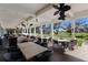 Outdoor patio with wicker furniture and golf course views at 3769 Caledonia Ln, Sarasota, FL 34240
