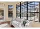 Bright sitting area with views of the pool, featuring large windows and comfortable seating for relaxation at 3769 Caledonia Ln, Sarasota, FL 34240