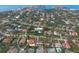 Beautiful aerial view of the neighborhood with mature trees, and a large body of water in the distance at 4946 Brywill Cir, Sarasota, FL 34234