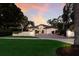 Charming one-story home boasts lush landscaping, a brick driveway and Mediterranean-style architecture at 4946 Brywill Cir, Sarasota, FL 34234